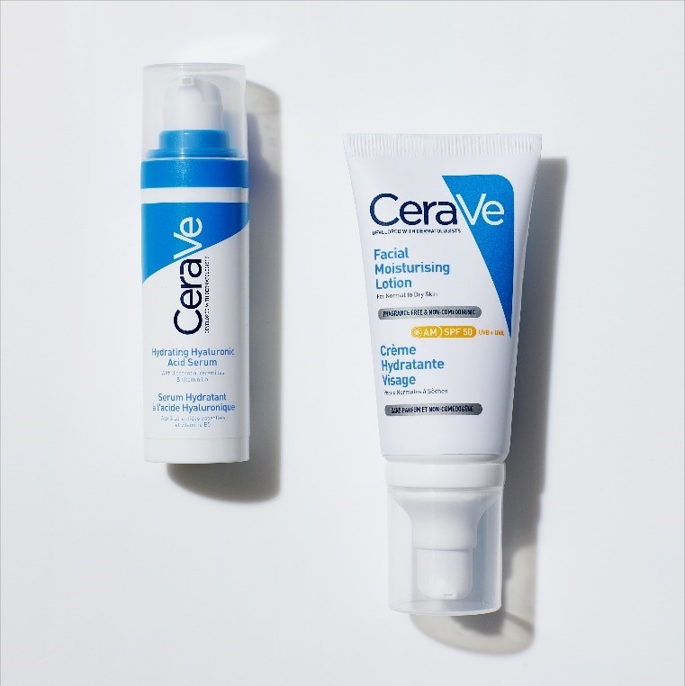 Birdseye view of 2 CeraVe moisturising products laying next to each other, creating a shadow. On the left: Hydrating Hyaluronic Acid Serum. On the right: Facial Moisturising Lotion SPF50.
